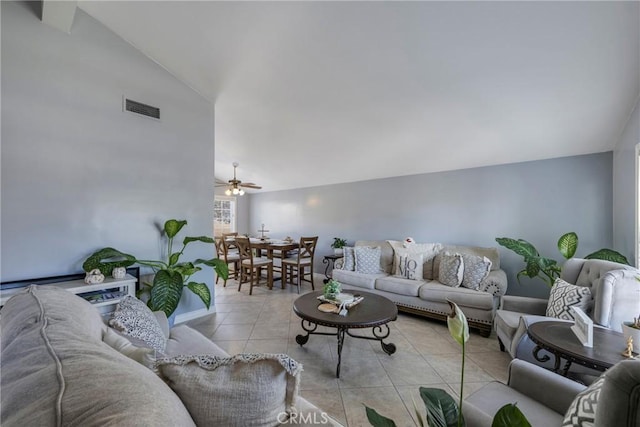 living room featuring light tile patterned floors, vaulted ceiling, and ceiling fan