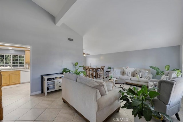 living room featuring ceiling fan, light tile patterned floors, sink, and high vaulted ceiling