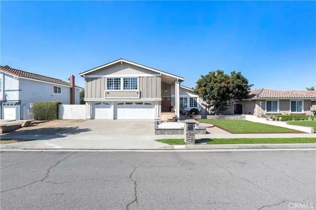 view of front facade with a front yard and a garage