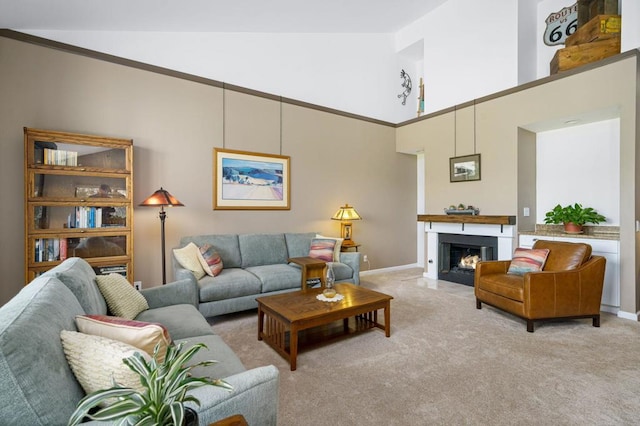 carpeted living room featuring high vaulted ceiling