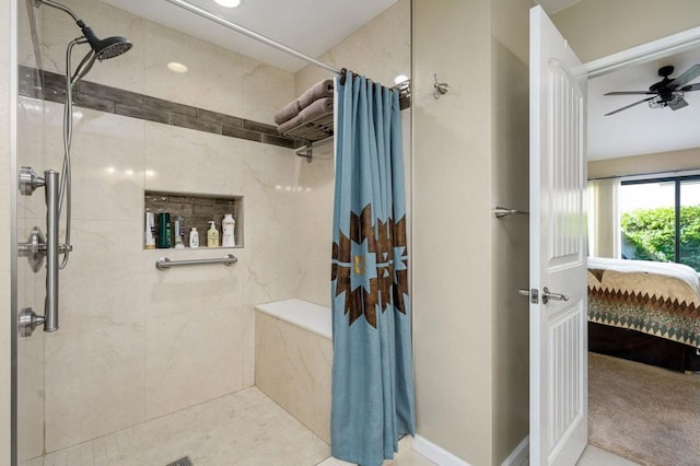 bathroom with curtained shower and ceiling fan