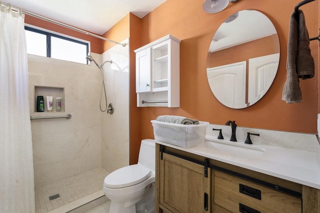 bathroom featuring vanity, tile patterned flooring, toilet, and walk in shower