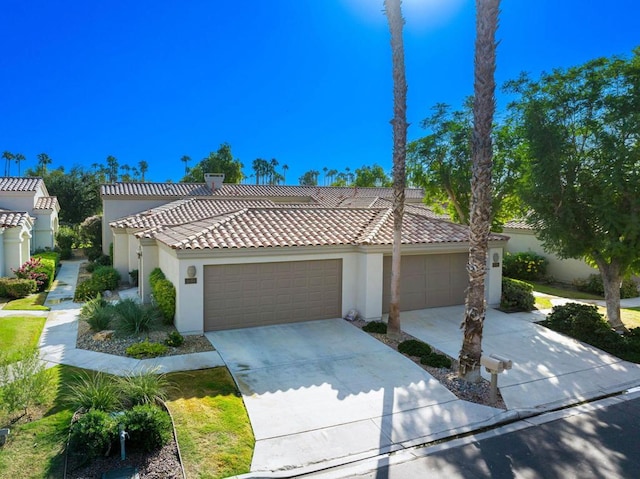 mediterranean / spanish house featuring a garage