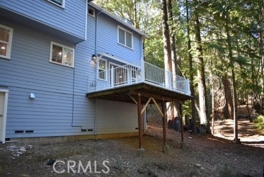 back of house featuring a deck