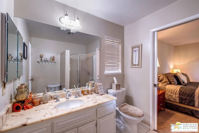 bathroom featuring vanity, an enclosed shower, and toilet