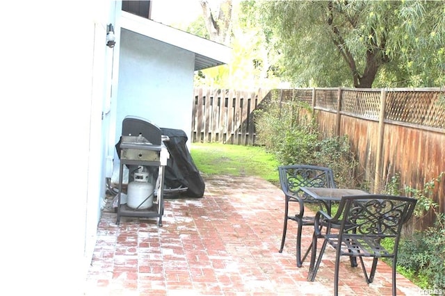 view of patio featuring a grill