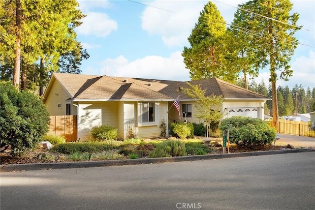 single story home featuring a garage