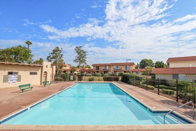 view of swimming pool with a patio area