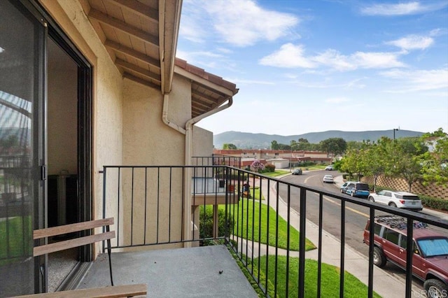 balcony featuring a mountain view