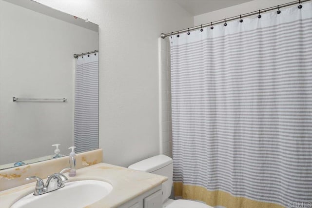 bathroom with vanity and toilet