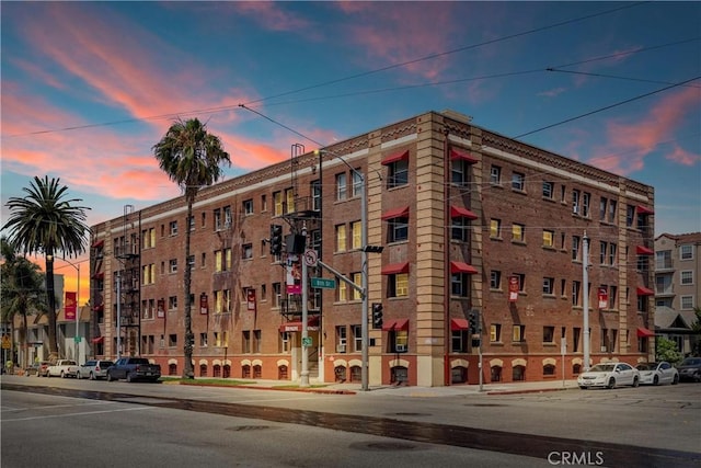 view of outdoor building at dusk