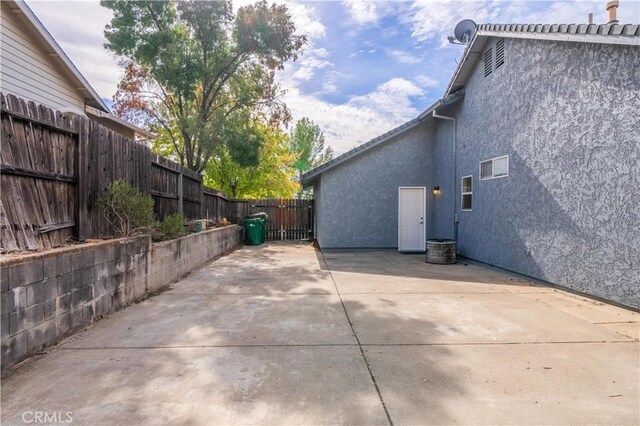 view of side of property featuring a patio area