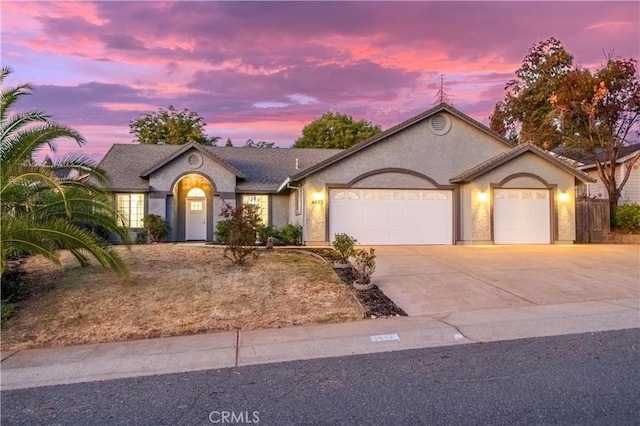 single story home featuring a garage