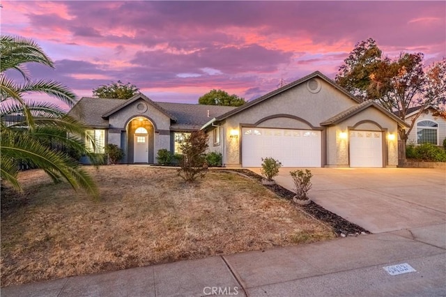 ranch-style home featuring a garage