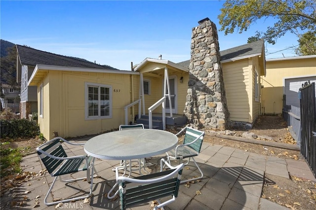 rear view of house featuring a patio area