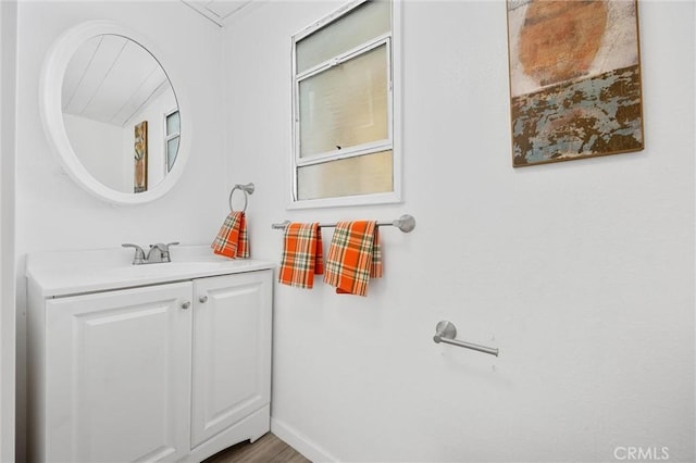 bathroom with hardwood / wood-style floors and vanity