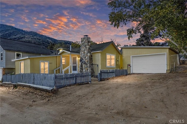 view of front of home featuring a mountain view and a garage