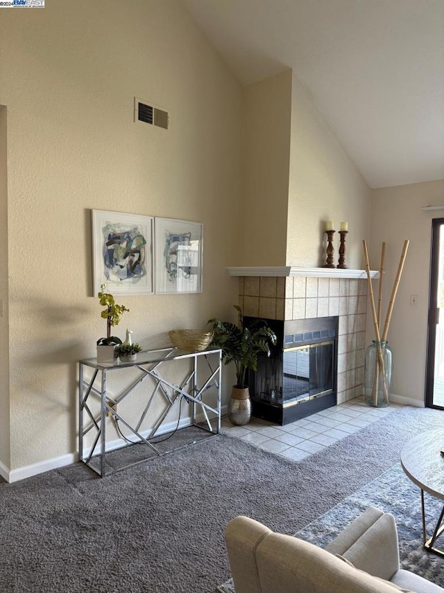 living room with carpet flooring, a fireplace, and high vaulted ceiling