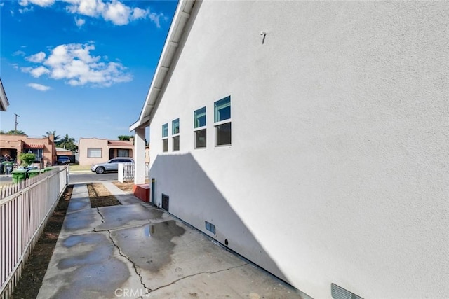 6050 Madden Ave, Los Angeles, CA 90043 - view of side of property with a residential view, stucco siding, and fence