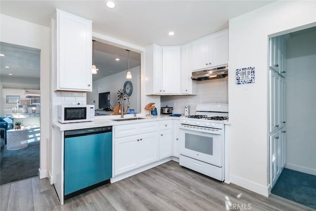 kitchen featuring white cabinetry, white appliances, sink, and light hardwood / wood-style flooring