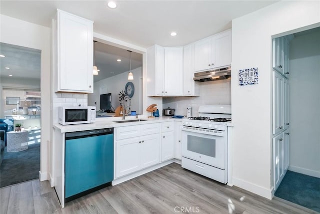 6050 Madden Ave, Los Angeles, CA 90043 - kitchen featuring white cabinets, a sink, light countertops, white appliances, and under cabinet range hood