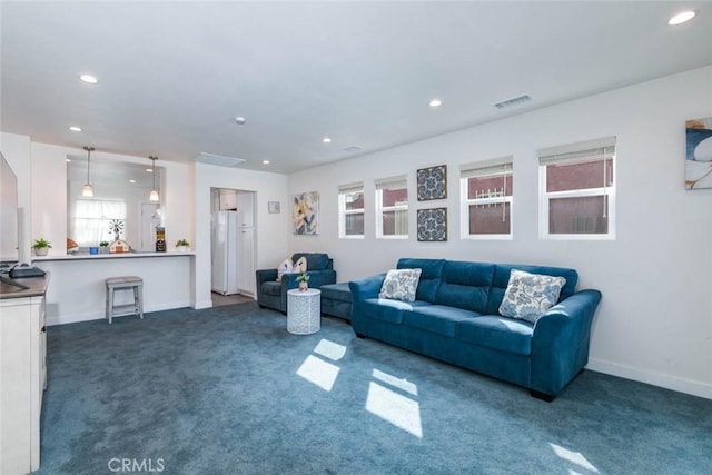 living room featuring dark carpet