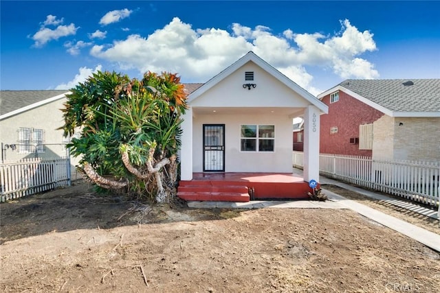 6050 Madden Ave, Los Angeles, CA 90043 - back of house with fence, covered porch, and stucco siding