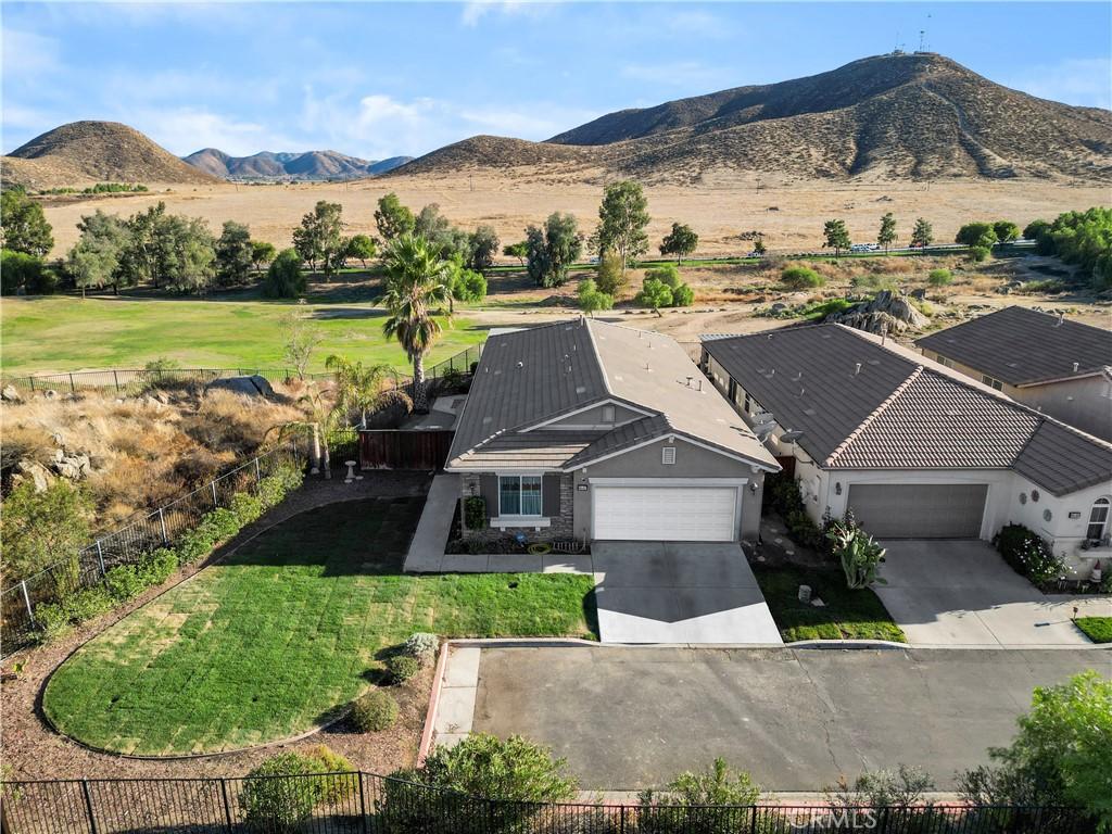 birds eye view of property with a mountain view