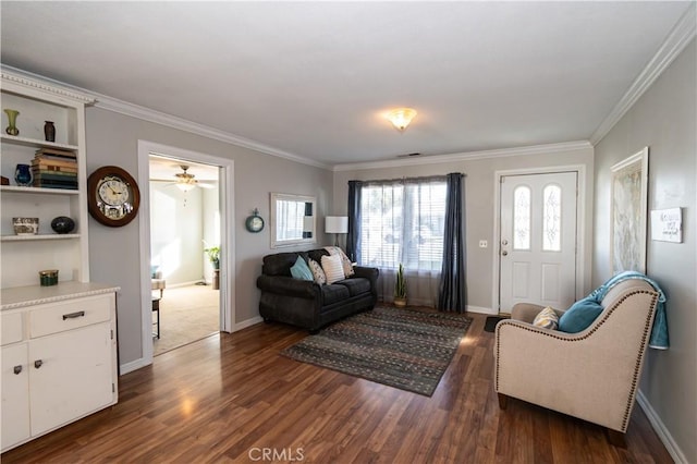 living room featuring dark hardwood / wood-style floors, ceiling fan, and crown molding