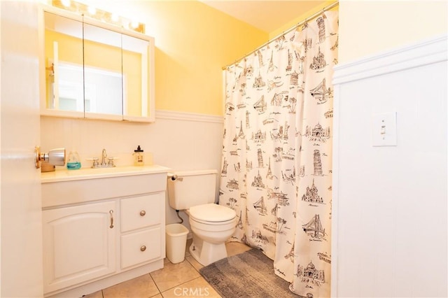 full bathroom featuring a shower with curtain, vanity, toilet, and tile patterned floors