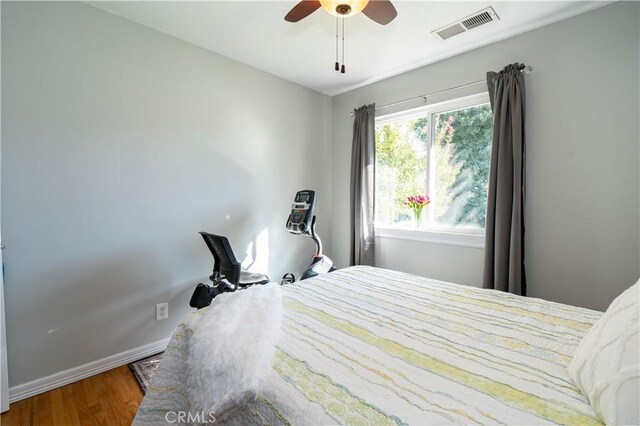 bedroom featuring hardwood / wood-style floors and ceiling fan