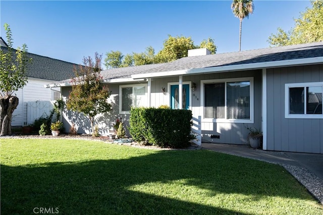 ranch-style house with a front lawn