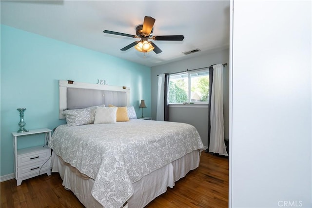 bedroom featuring ceiling fan and dark hardwood / wood-style flooring