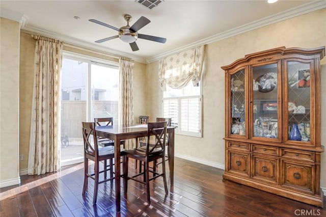 dining area featuring ceiling fan, dark hardwood / wood-style flooring, and crown molding