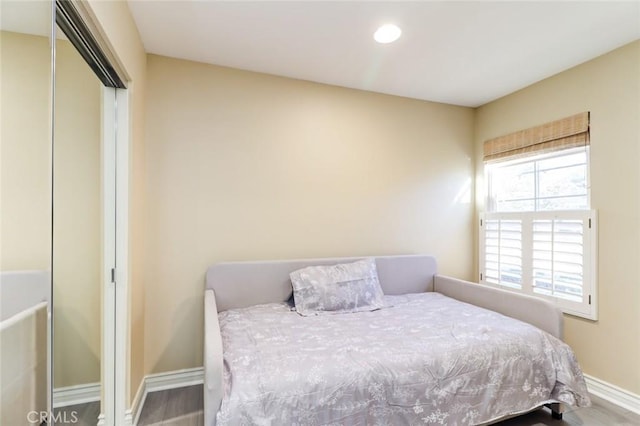 bedroom with hardwood / wood-style floors