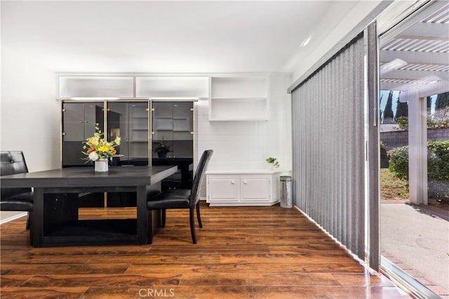 dining space featuring dark wood-type flooring