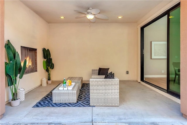 view of patio / terrace with an outdoor living space and ceiling fan