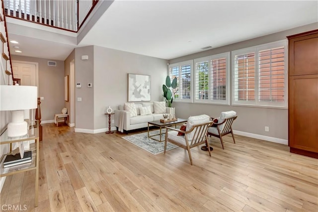 living room with light hardwood / wood-style floors