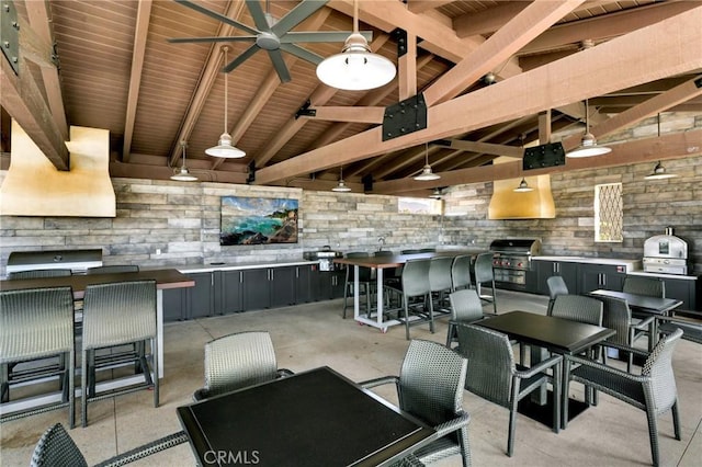 interior space featuring vaulted ceiling with beams, ceiling fan, and wood ceiling