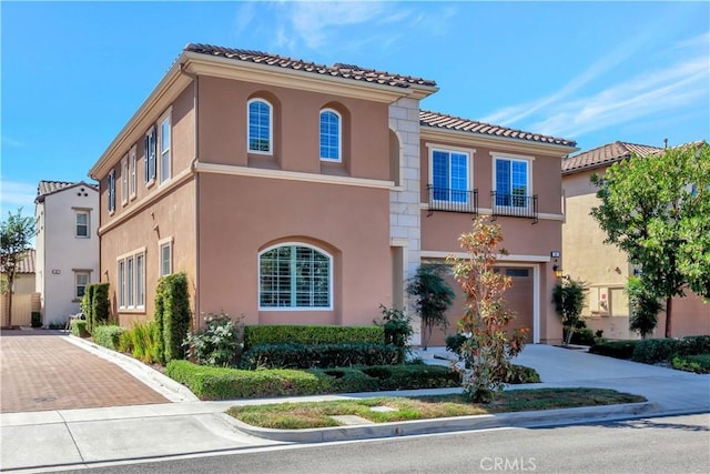 mediterranean / spanish house featuring a garage