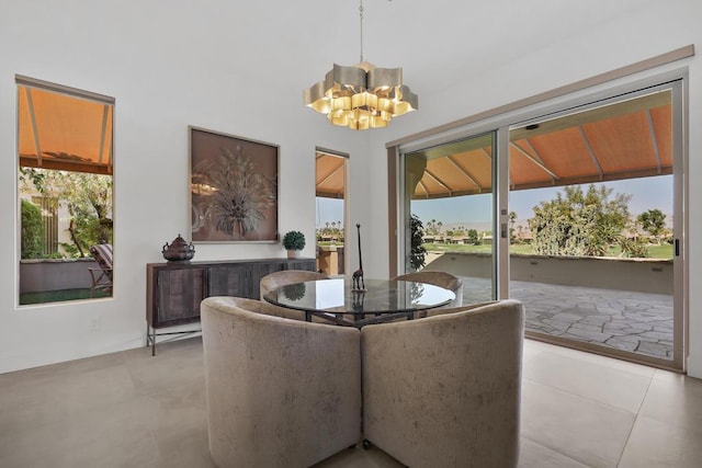 dining area featuring a notable chandelier