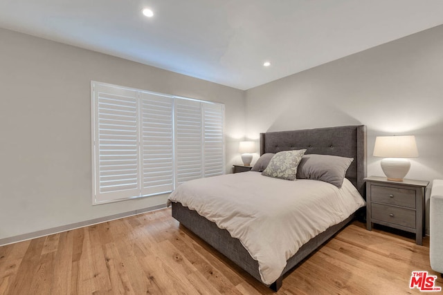 bedroom with light wood-type flooring