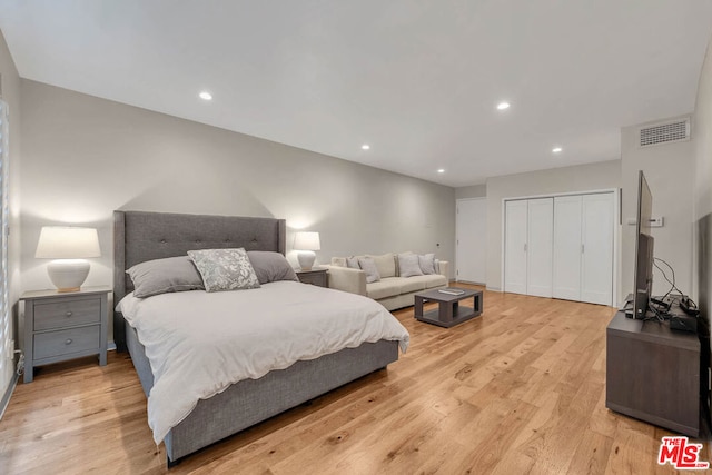 bedroom featuring a closet and light hardwood / wood-style floors