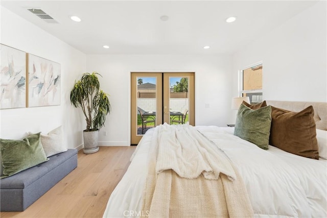 bedroom with access to outside and light hardwood / wood-style flooring