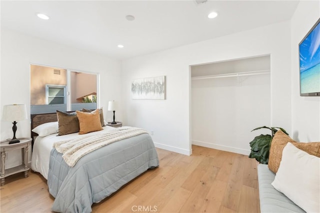 bedroom featuring a closet and light hardwood / wood-style floors