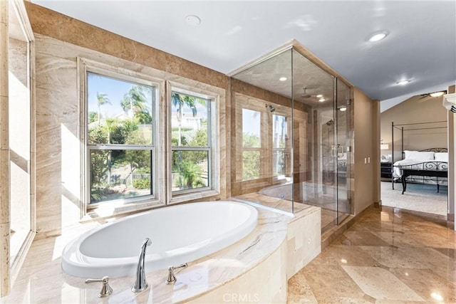 bathroom featuring separate shower and tub and vaulted ceiling