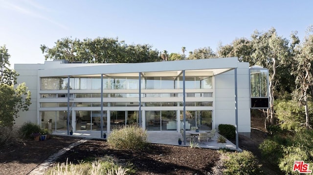 rear view of property featuring a patio area