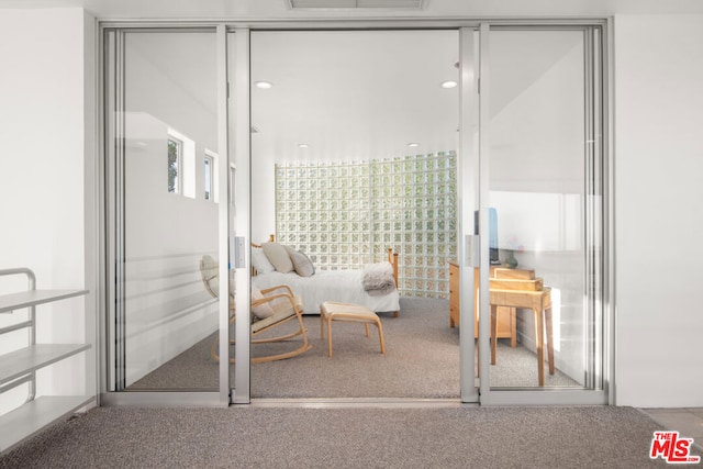 living area featuring carpet floors