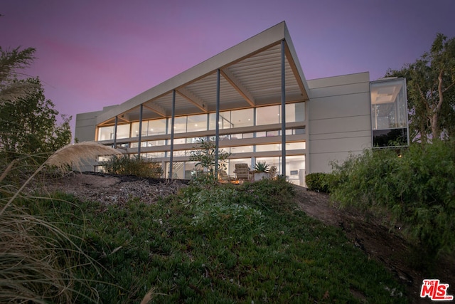 view of property exterior at dusk