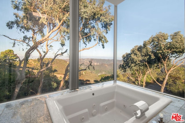 bathroom with tiled tub